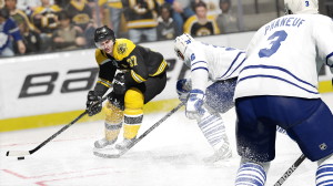 A screencap showing NHL 15 cover star Patrice Bergeron on the ice, courtesy of EA Sports
