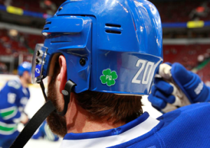 Above: Players sported helmets adorned with a PQ decal in honour of Pat Quinn who passed away Sunday in Vancouver after a long battle with illness.