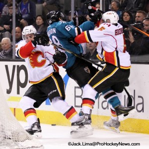 (L-R) TJ Brodie - Melker Karlsson and Mark Giordano collide behind the net (525x525)